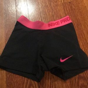 Pink and black Nike pro